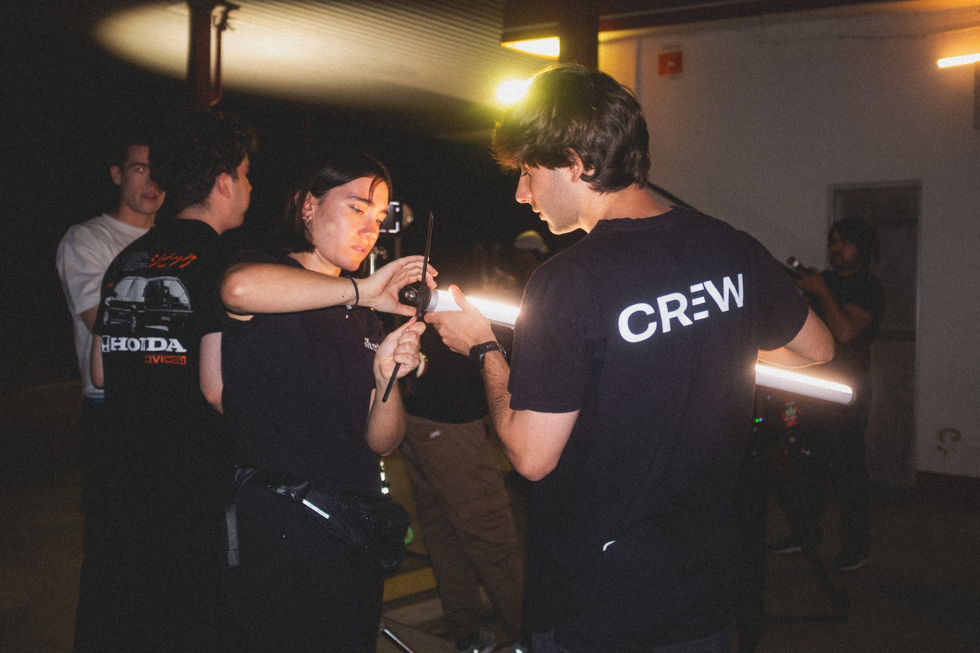 Crew member operating camera on set
